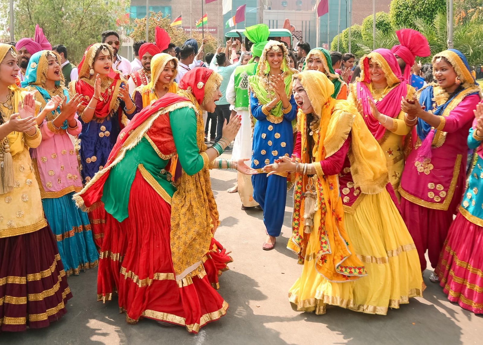 Colorful traditional dance celebration during a vibrant festival in Moga, Punjab, India.