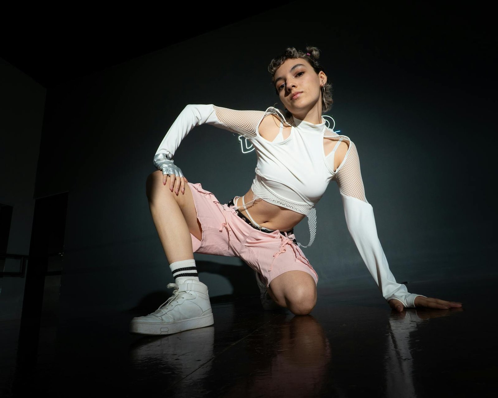 A striking portrait of a female dancer in dynamic pose, showcasing modern dance style.