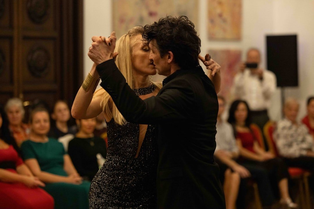 Couple dancing tango in front of an audience