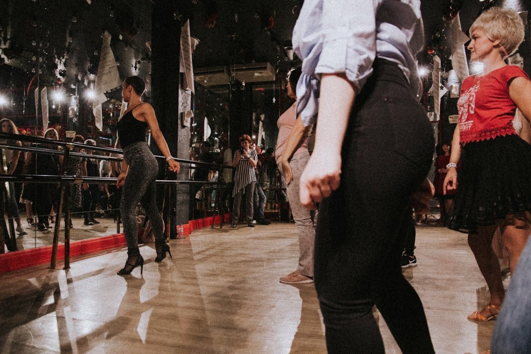 a group of people standing around in a room
