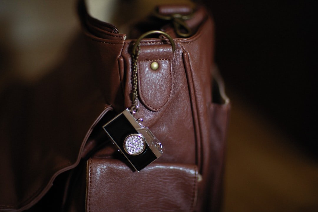 a brown purse with a tag attached to it